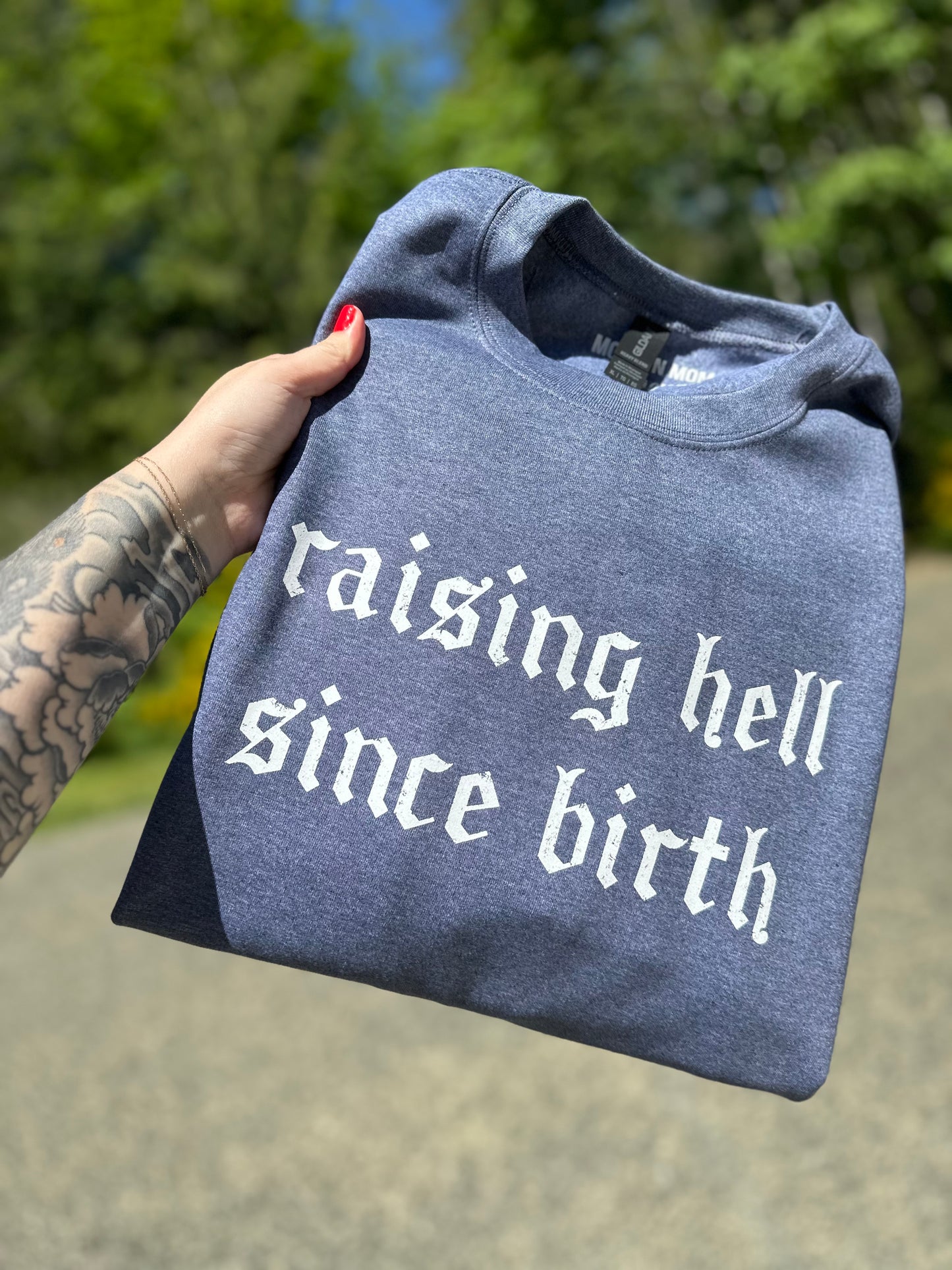 Raising hell since birth Crewneck