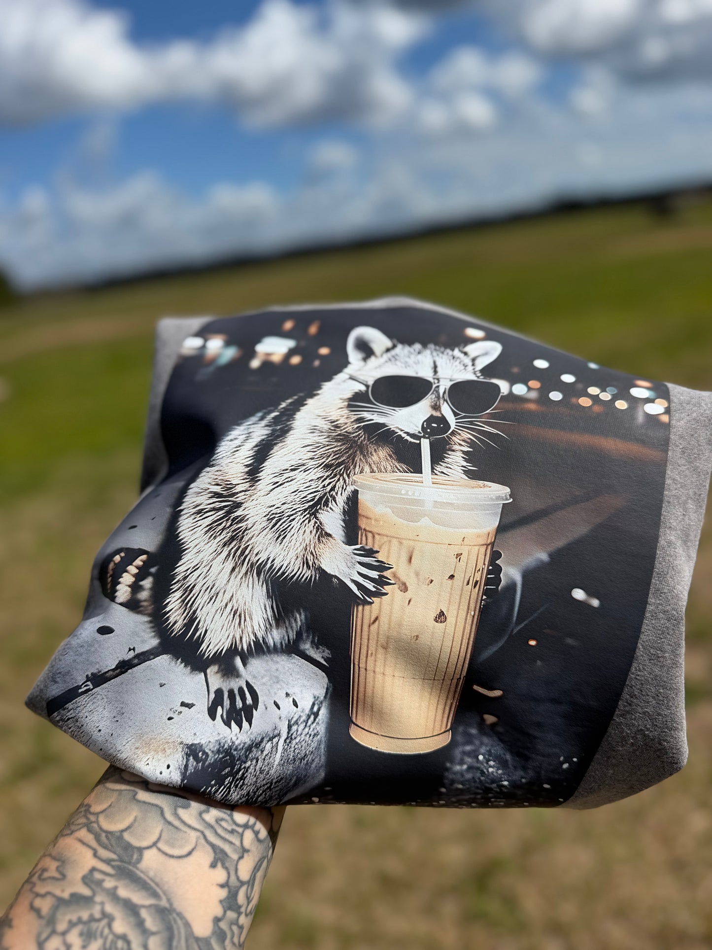 Caffeinated raccoon (tee, crewneck, or hoodie)