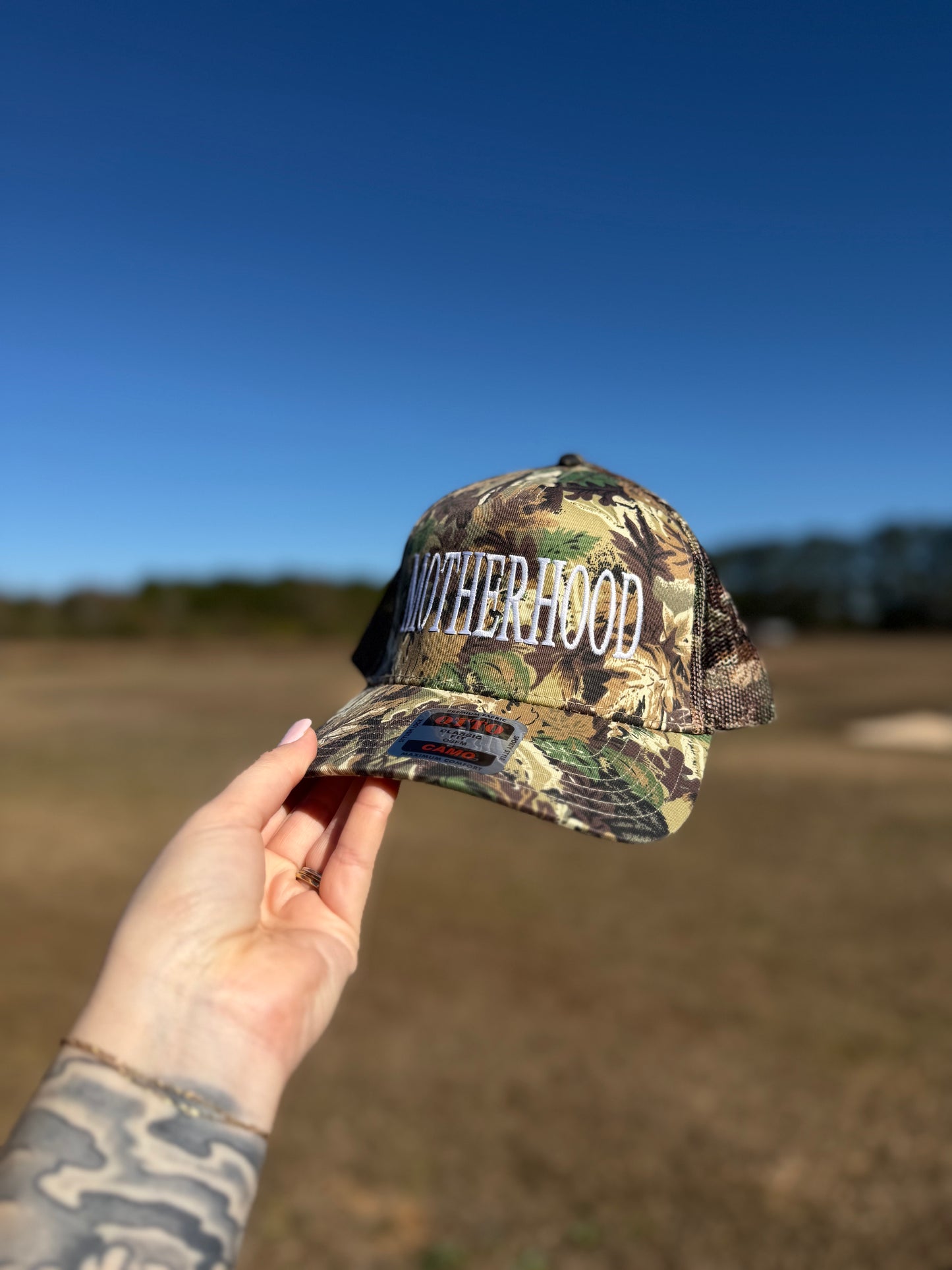 Motherhood camo mesh back truckers