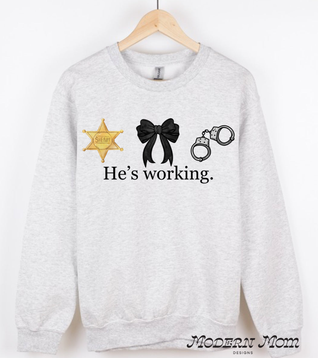 He’s working. Sheriff