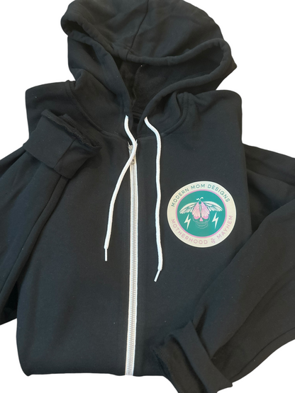 Motherhood & Mayhem re-brand zip up black w/ teal