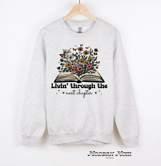 Livin’ through the next chapter crewneck