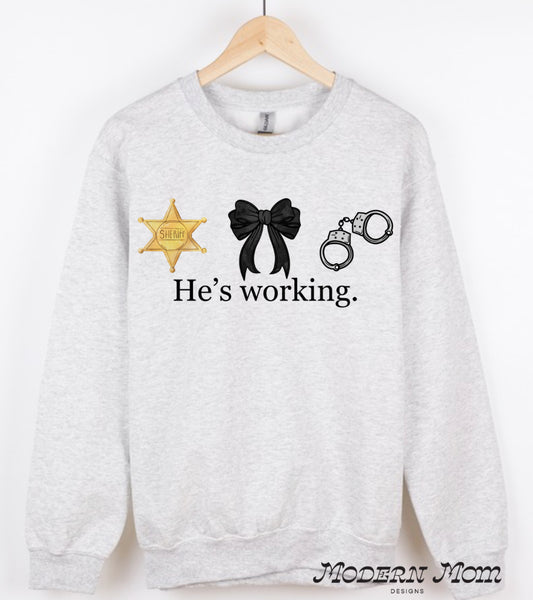 He’s working. Sheriff